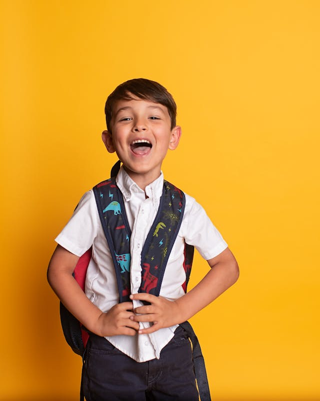 German classes for children in Frankfurt – laughing boy with school bag